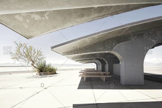 Picnic tables under concrete structures