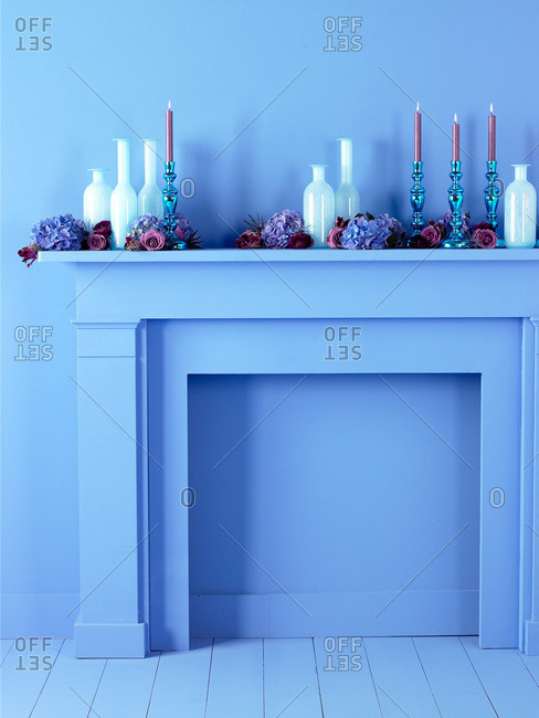 Blue fireplace mantel with decorations