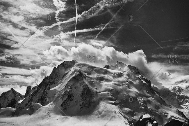 The north face of Mont Blanc du Tacul and jet contrails in the sky ,Chamonix, France