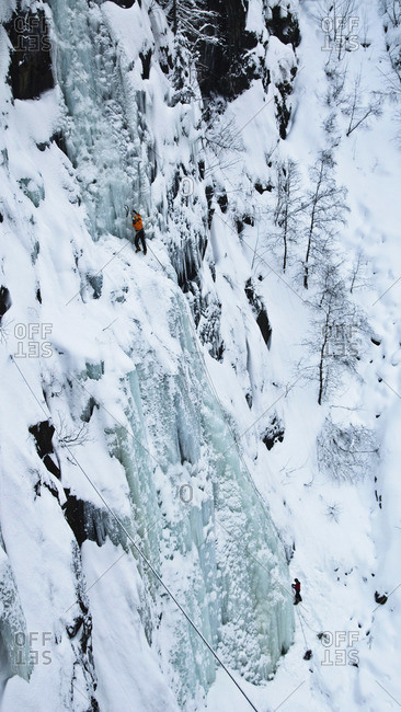 A team of climbers on the classic Vemorkbrufossen Vest, Norway
