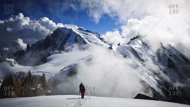 Man heading down from the Aiguille du Plan, France