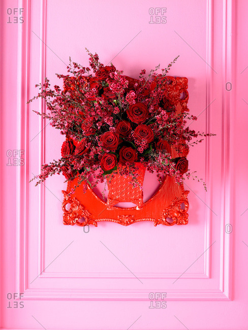 Red flowers on a pink wall