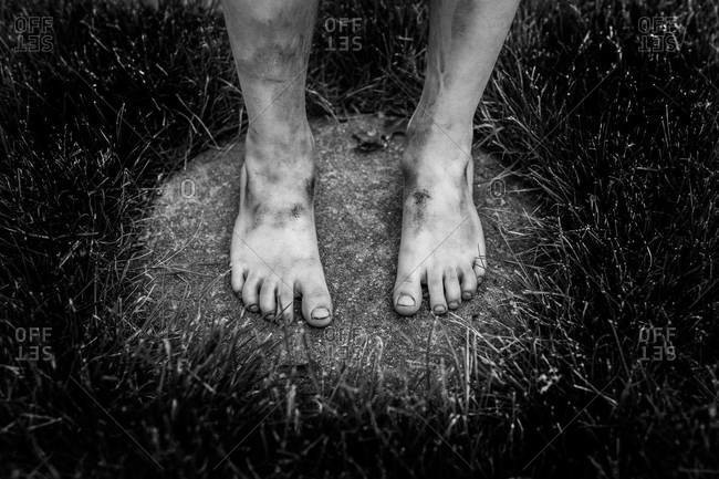 Close up of a child\'s dirty feet