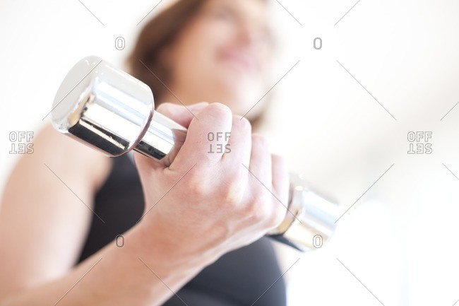 Woman using hand weight