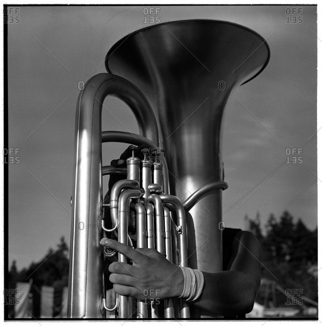 Tuba player hidden behind his instrument
