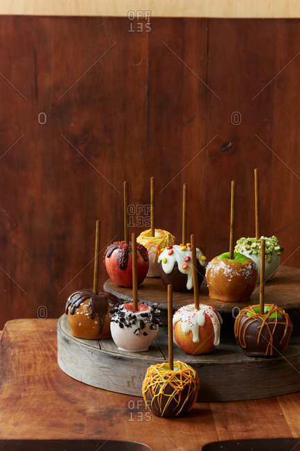 Candy and caramel apples on a cake stand