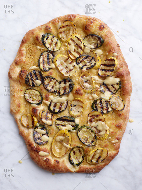 Top view of grilled zucchini pizza