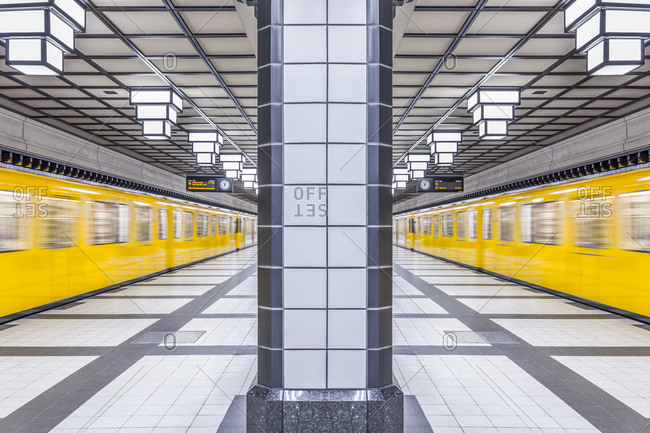 Subway station Paracelsiusbad with moving underground train, Berlin, Germany