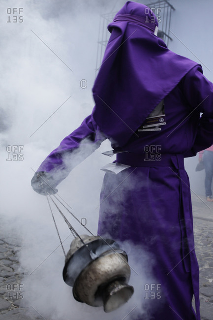 Person swinging an incense at the Semana Santa celebration in Antigua, Guatemala