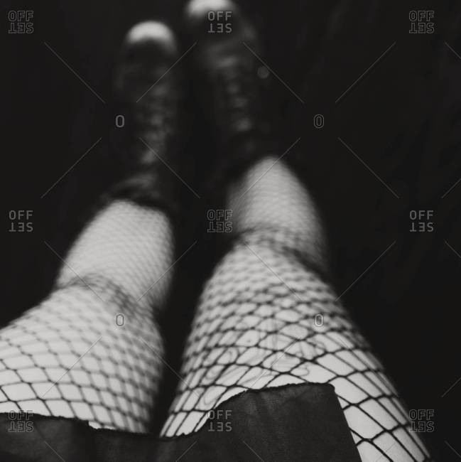 Close up of a woman in fishnet stockings