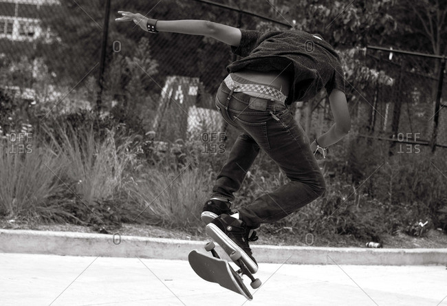 Teenager doing a skateboarding stunt