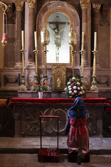 Woman praying in church, San Miguel de Allende, Mexico