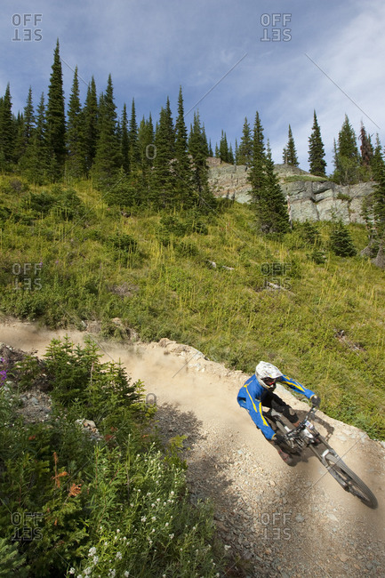 A mountain biker races downhill on the Runaway Train trail in Whitefish, Montana