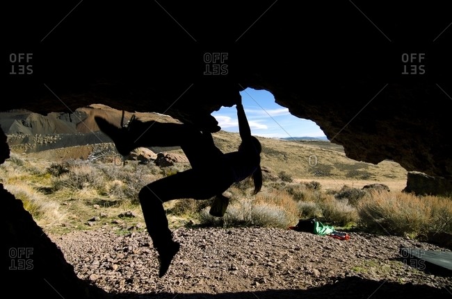 A silhouette of a woman bouldering in Washoe Valley, Nevada
