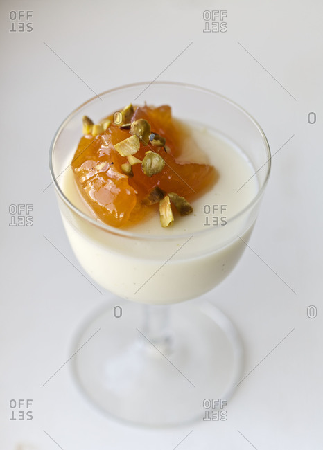 Buttermilk panna cotta with peach jam and pistachios