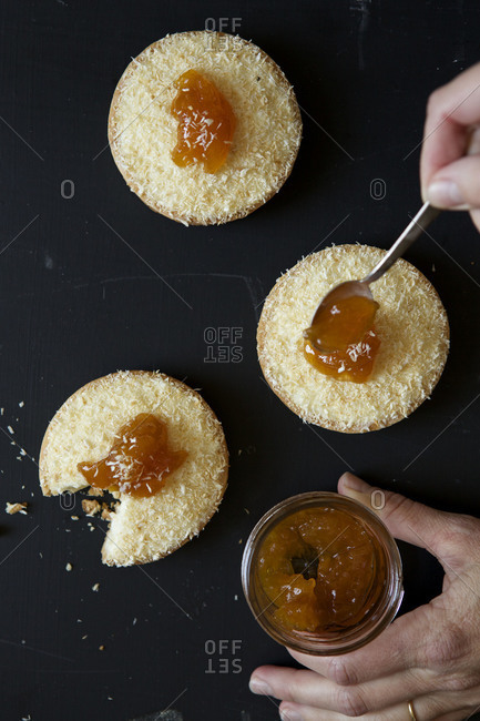 Buttermilk panna cotta tarts with coconut and peach jam