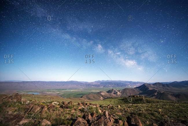 View over the desert and the Sierra Nevada mountains with the Milky Way overhead on Monitor Pass near Markleeville, California