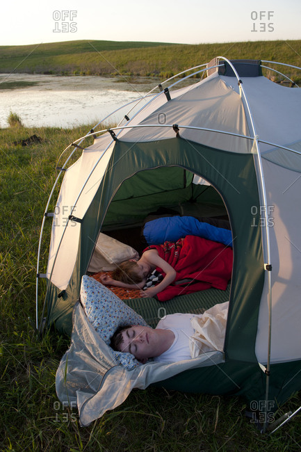 Two brothers sleep during a camping trip