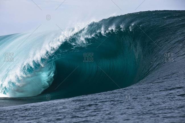 Massive ocean wave barrel in Tahiti