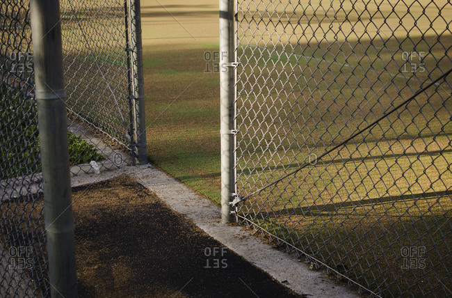 Fence outside empty baseball field