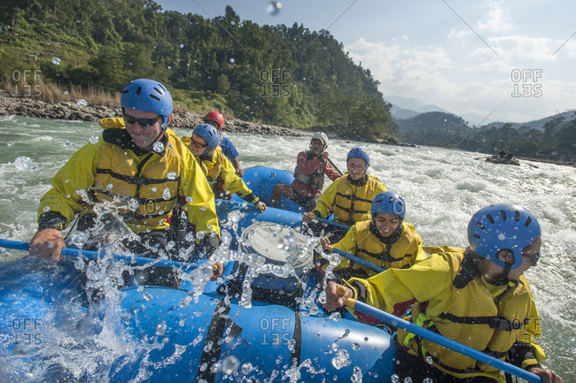 Rafters get splashed as they go through some big rapids on the Trisuli river in Nepal