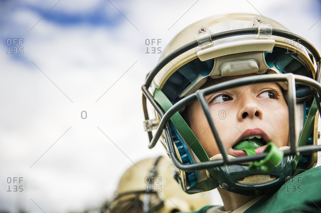 Close-up of young boy football player