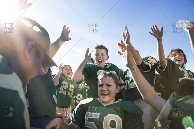 Coach gives youth football team pre-game pep talk