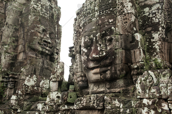 Buddha faces carved in stone at Bayon temple, Angkor Wat temple complex, Cambodia