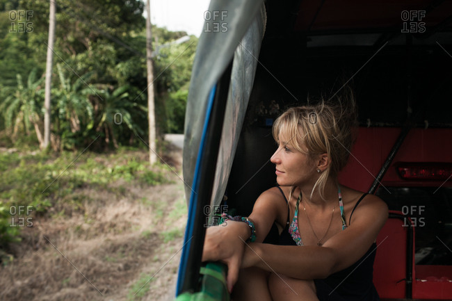 Blonde woman discovers Koh Chang district in Thailand with auto rickshaw