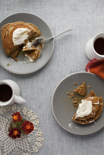 Pumpkin pancakes served with coffee on a table
