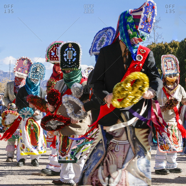 Traditional Chichimeca dancers at the celebration of Virgin Guadalupe in Tortugas Pueblo, New Mexico, USA