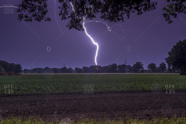 Lightning strike on the countryside at night