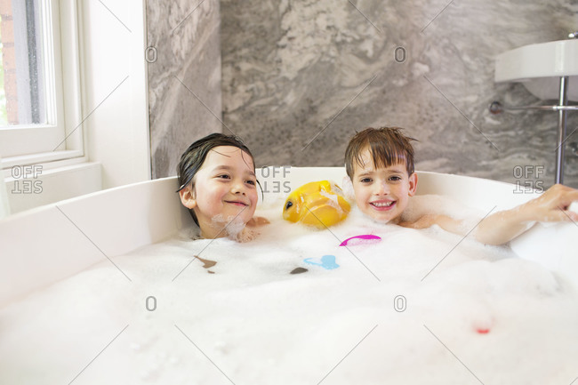 Children having a bubble bath together