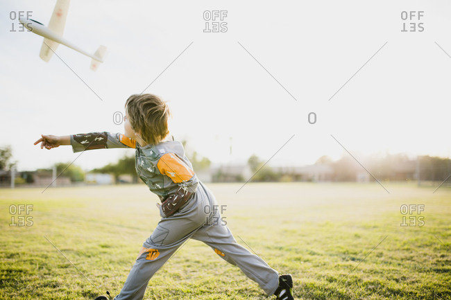 Boy throwing a model airplane