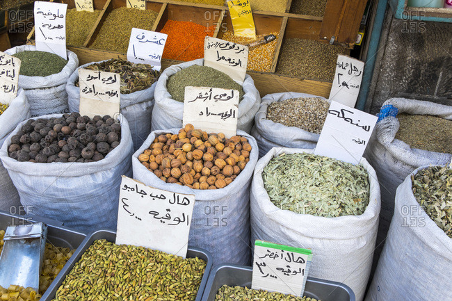 Arabic priced and labeled sacks of spices in a shop in Amman, Jordan