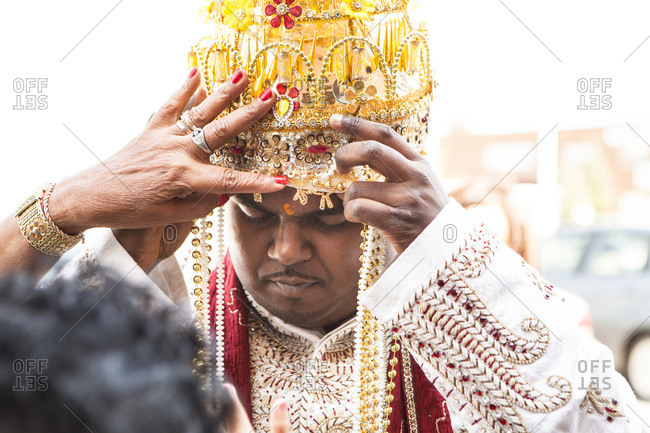 Close-up of Hindu man getting reading for wedding, Toronto, Ontario, Canada