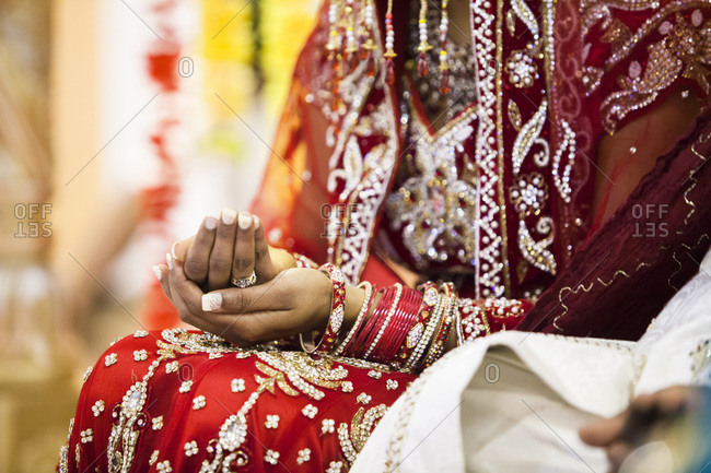 Close-up of woman\'s hands during Hindu wedding ceremony, Toronto, Ontario, Canada