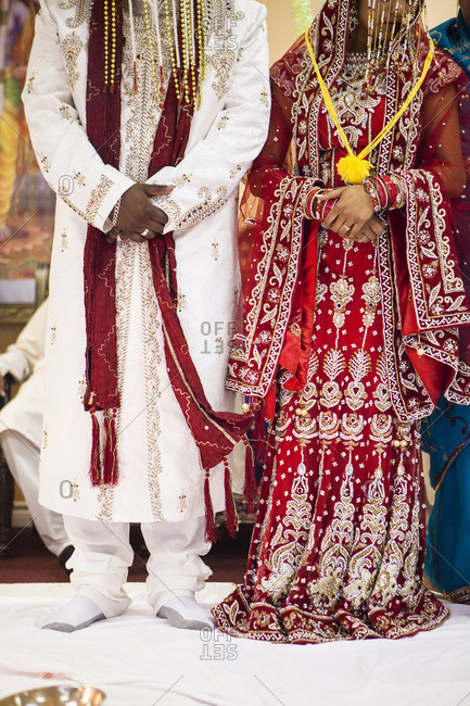 Traditional clothing worn by Hindu bride and groom at wedding, Toronto, Ontario, Canada