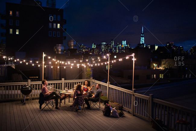 Young people having a rooftop party, Brooklyn