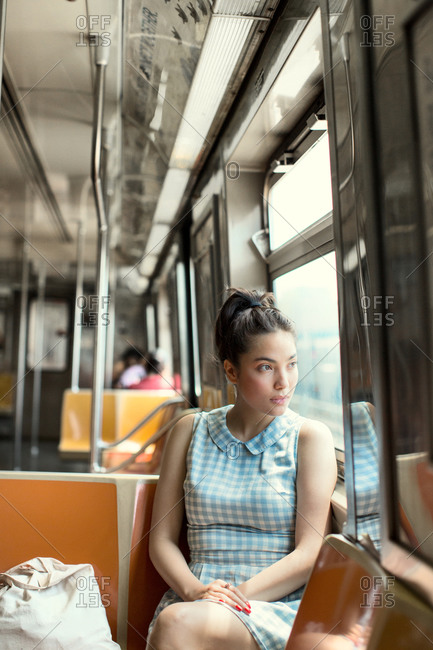 Young woman on subway car