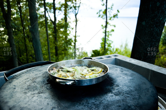 Lemon and fennel steaming on an outdoor burner