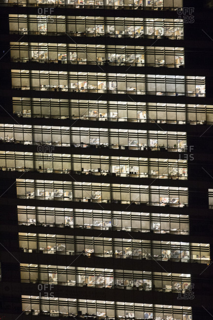 Illuminated office building at night in New York, USA