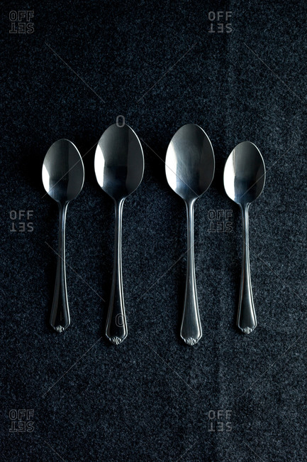 Four spoons in a row