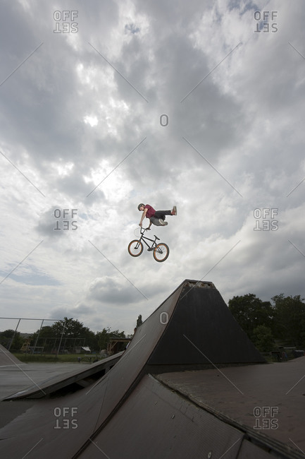 A BMX rider doing a stunt in mid air