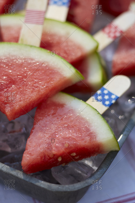 Watermelon slices on a tray of ice