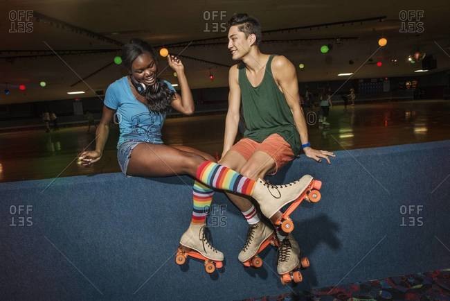 Young people having fun at a roller skate rink