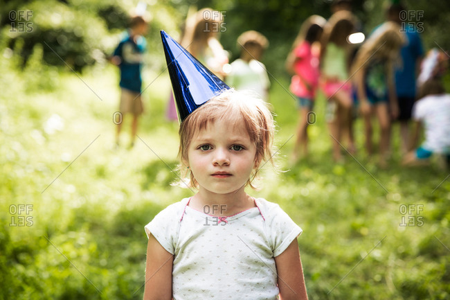 Portrait of a girl wearing birthday party hat