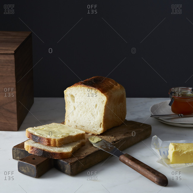 Butter spread over slices of bread