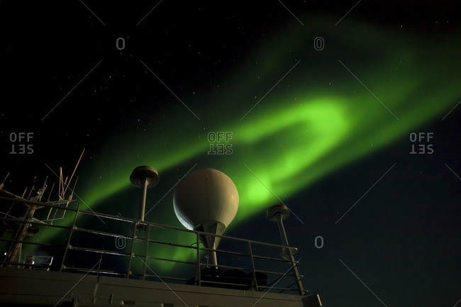 Aurora Borealis viewed from a boat deck near Nordvest Fjord