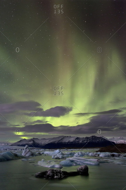 The Aurora Borealis (Northern Lights) captured in the night sky over Jokulsarlon glacial lagoon on the edge of the Vatnajokull National Park, Iceland